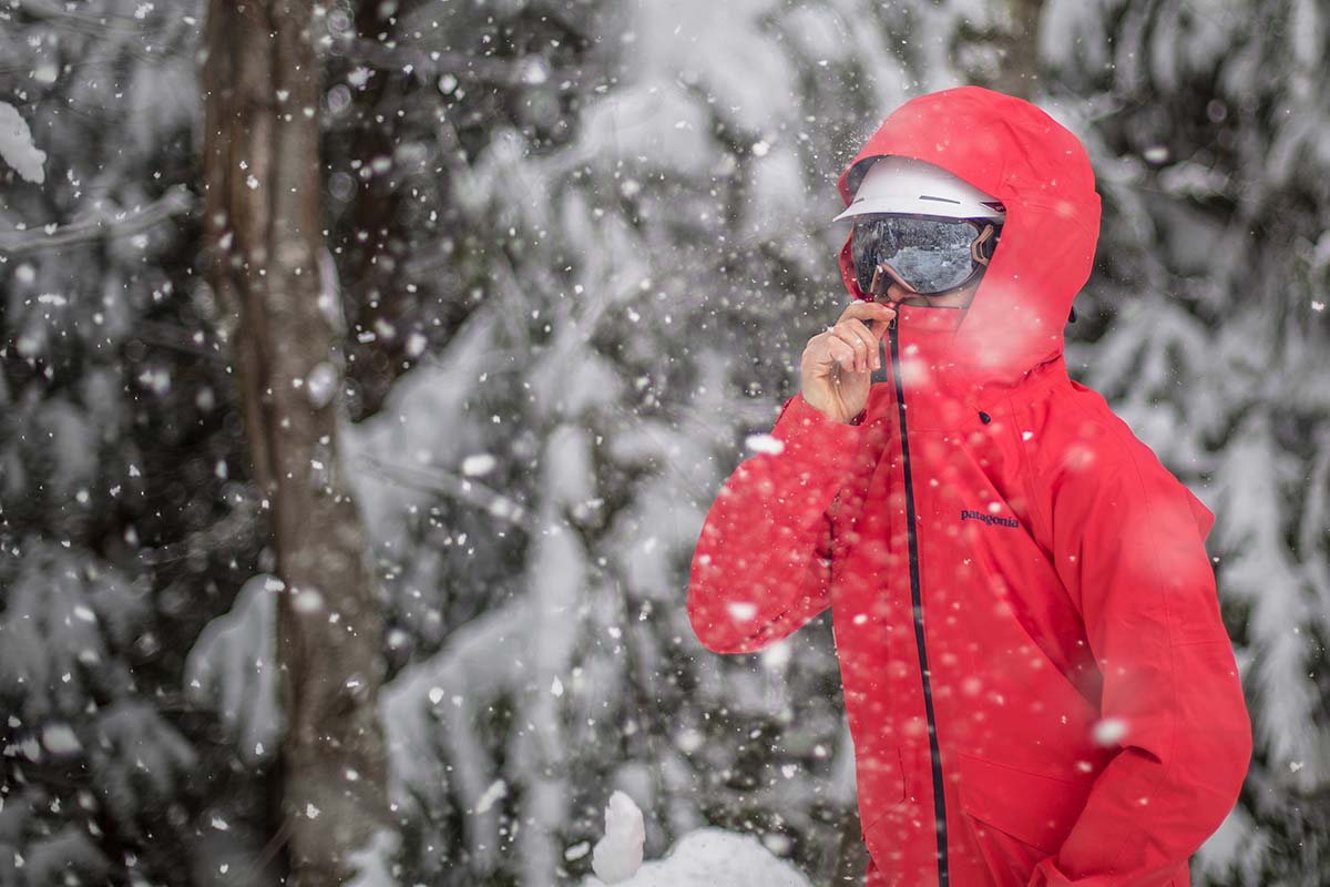 Women's ski jacket (zipping up the Patagonia Insulated Snowbelle in snowstorm)